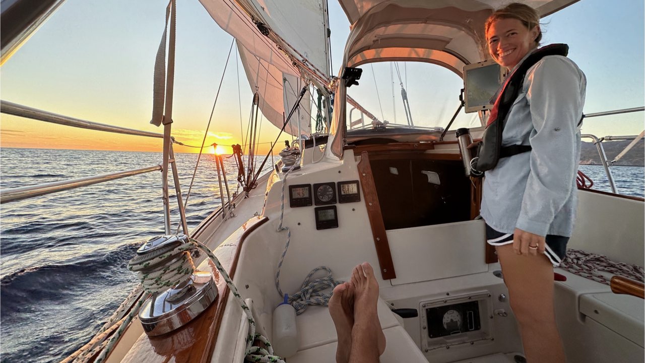 Katherine standing in the cockpit as Ana Maria sails