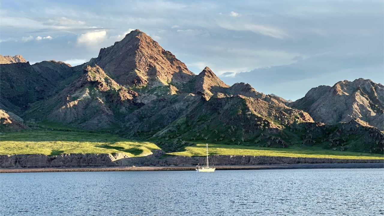 Sailboat passing in front of Puerto Refugio